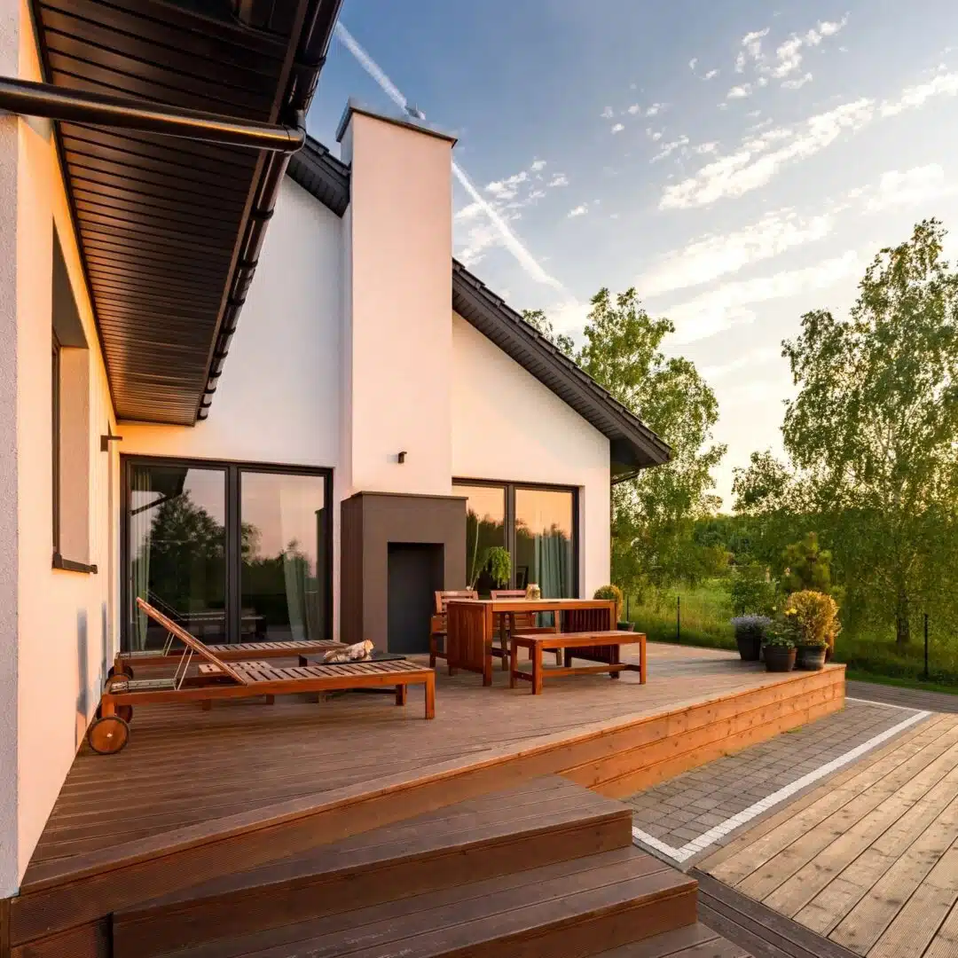 A patio with furniture and a fire place.