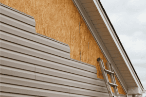 Greenway Exteriors Team installing fiber cement siding on a residential home in Wichita, KS