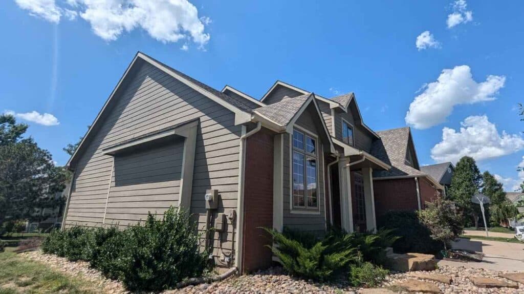 A Wichita home with newly installed siding by Greenway Exteriors, enhancing curb appeal and property value.