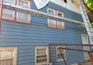 Greenway Exteriors crew performing siding replacement on a Wichita home